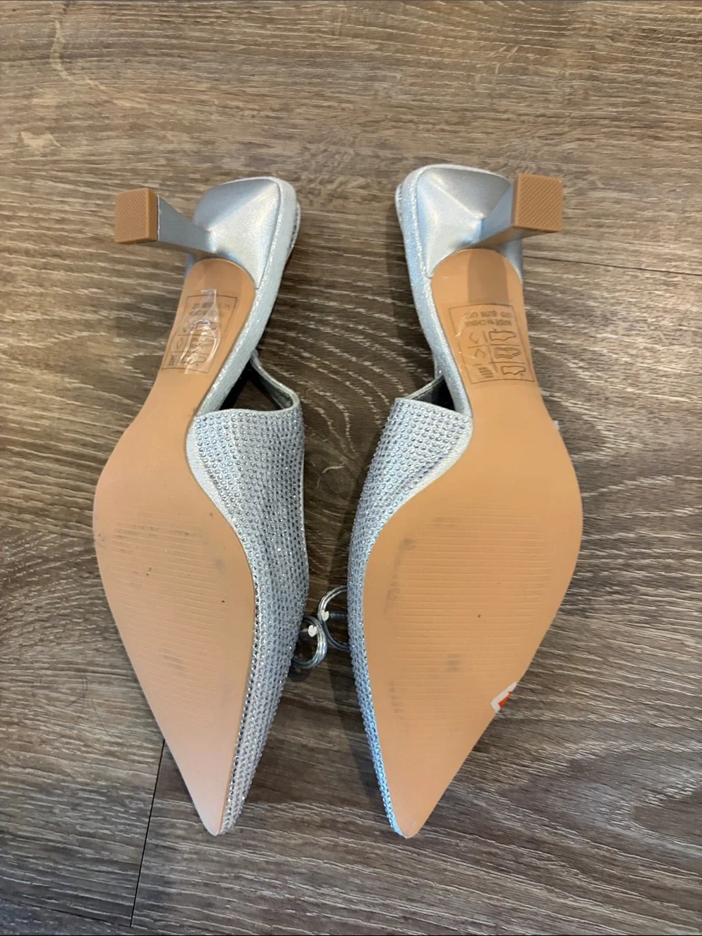 Glamorous Silver Pointed Slingback Heels with Bow Accent
